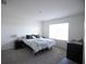 Bright bedroom featuring neutral colored walls, carpet flooring and natural light at 5062 Foxglove Cir, Lakeland, FL 33811