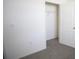 Empty walk in closet with white wire shelving and plush carpeting at 5062 Foxglove Cir, Lakeland, FL 33811