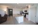 Bright kitchen with stainless steel appliances, white cabinetry, large countertop and tile flooring at 5062 Foxglove Cir, Lakeland, FL 33811