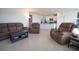 Spacious living room with tile floors, recessed lighting, and an open layout to the kitchen at 5062 Foxglove Cir, Lakeland, FL 33811