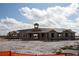 Unfinished large block building under a blue sky with partial roof and open doorways at 5062 Foxglove Cir, Lakeland, FL 33811