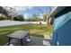 Spacious backyard with a grassy area and a black patio table at 515 Crevasse St, Lakeland, FL 33805