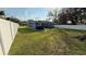 Large backyard with a white privacy fence at 515 Crevasse St, Lakeland, FL 33805
