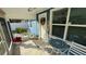 Bright and airy screened porch with tiled floor and seating at 515 Crevasse St, Lakeland, FL 33805