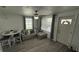 Open concept living room with sectional sofa and adjacent dining area at 515 Crevasse St, Lakeland, FL 33805
