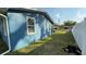 The home has a fenced side yard with a grassy area at 515 Crevasse St, Lakeland, FL 33805
