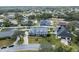 Spacious aerial view of two-story home with landscaped lawn, long driveway and street parking at 5155 Lake Deeson Woods Ct, Lakeland, FL 33805