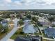 Neighborhood aerial view showing property in quiet area with mature trees and community pool at 5155 Lake Deeson Woods Ct, Lakeland, FL 33805