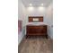 Close-up of bathroom with an antique vanity featuring ample space and beautiful craftsmanship in a comfortable setting at 5155 Lake Deeson Woods Ct, Lakeland, FL 33805