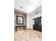 Spacious foyer with travertine floors, modern mirror and high ceilings at 5155 Lake Deeson Woods Ct, Lakeland, FL 33805