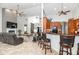 Open-concept kitchen and living room with breakfast bar and elegant furnishings at 5155 Lake Deeson Woods Ct, Lakeland, FL 33805