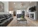 Large living room with a fireplace and lots of natural light at 5155 Lake Deeson Woods Ct, Lakeland, FL 33805