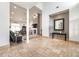 Open-concept living room with high ceilings, fireplace, and travertine flooring at 5155 Lake Deeson Woods Ct, Lakeland, FL 33805