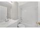 This bathroom is all white and features a shower/tub combo, and a large vanity at 519 Eagle Ct, Kissimmee, FL 34759