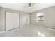 Comfortable bedroom with a ceiling fan, closet, and neutral paint, offering a relaxing retreat at 519 Eagle Ct, Kissimmee, FL 34759