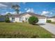 Charming single-story home with manicured lawn, driveway, and attached two-car garage at 519 Eagle Ct, Kissimmee, FL 34759