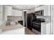 Contemporary kitchen with granite countertops, modern appliances, and ample cabinet space at 519 Eagle Ct, Kissimmee, FL 34759
