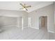 Open living room featuring tile flooring, neutral paint and high ceilings at 519 Eagle Ct, Kissimmee, FL 34759