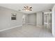 Living room with a ceiling fan and light, tile flooring, and open doorway leading to hall at 519 Eagle Ct, Kissimmee, FL 34759