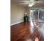 Bright bedroom featuring hardwood floors and sliding glass doors to private patio at 528 Laurel Ln, Lakeland, FL 33813