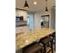 Modern kitchen featuring granite countertops, a large island, and stainless steel appliances at 528 Laurel Ln, Lakeland, FL 33813