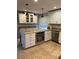 Updated kitchen with granite countertops, stainless steel appliances, and ample cabinet space at 528 Laurel Ln, Lakeland, FL 33813