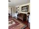 Comfortable living room featuring hardwood floors, a couch, and custom built-in shelving at 528 Laurel Ln, Lakeland, FL 33813