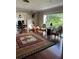 Cozy living room featuring hardwood floors, natural light, and decorative accents at 528 Laurel Ln, Lakeland, FL 33813
