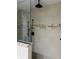 Luxurious shower with dual showerheads and a decorative tile accent stripe at 528 Laurel Ln, Lakeland, FL 33813