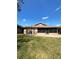 A well-maintained backyard features a brick patio perfect for outdoor entertaining at 600 Caribbean Dr, Lakeland, FL 33803
