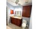 Bathroom features single sink vanity, overhead lighting and neutral paint at 600 Caribbean Dr, Lakeland, FL 33803