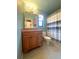 Bathroom featuring vanity with framed mirror and shower with curtain at 600 Caribbean Dr, Lakeland, FL 33803