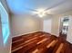Bedroom with hardwood floors, ceiling fan and closet at 600 Caribbean Dr, Lakeland, FL 33803