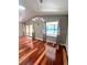 Dining room with vaulted ceilings, hardwood floors, and a sliding glass door at 600 Caribbean Dr, Lakeland, FL 33803