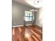 Bright dining room features hardwood floors, chandelier, and large windows at 600 Caribbean Dr, Lakeland, FL 33803