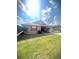 Charming single-story home with manicured lawn, mature landscaping, and a welcoming facade at 600 Caribbean Dr, Lakeland, FL 33803