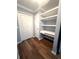 Hallway including built-in shelves and storage, next to a closet at 600 Caribbean Dr, Lakeland, FL 33803