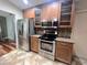 Kitchen boasts stainless steel appliances, granite countertops, and tile backsplash at 600 Caribbean Dr, Lakeland, FL 33803