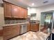Well-lit kitchen features granite countertops and stainless steel appliances at 600 Caribbean Dr, Lakeland, FL 33803