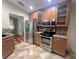 Kitchen featuring stainless steel appliances, granite countertops, and tile flooring at 600 Caribbean Dr, Lakeland, FL 33803