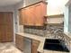 Kitchen features granite countertops, stainless steel appliances and mosaic backsplash at 600 Caribbean Dr, Lakeland, FL 33803