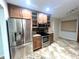 Kitchen with stainless steel appliances, granite countertops, and tiled floors at 600 Caribbean Dr, Lakeland, FL 33803