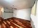 Inviting living room featuring vaulted ceilings, fan, and hardwood floors at 600 Caribbean Dr, Lakeland, FL 33803