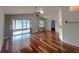 Bright, open living space featuring vaulted ceilings, fan, and hardwood floors at 600 Caribbean Dr, Lakeland, FL 33803