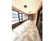 Enclosed patio with tile flooring, brick walls and ample windows for natural light at 600 Caribbean Dr, Lakeland, FL 33803