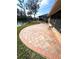 The brick paved patio extends to the lake for enjoyable outdoor living at 600 Caribbean Dr, Lakeland, FL 33803