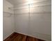 Spacious walk-in closet complete with wire shelving for easy organization at 600 Caribbean Dr, Lakeland, FL 33803