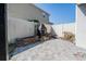 Fenced backyard patio with stone planters and fire pit with brick accent; perfect for outdoor relaxation at 6011 Placid Pass, Lakeland, FL 33805