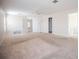 Expansive carpeted bedroom with multiple doorways and a ceiling fan at 6011 Placid Pass, Lakeland, FL 33805