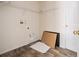 Laundry room with wood-look flooring and wire shelving at 6011 Placid Pass, Lakeland, FL 33805